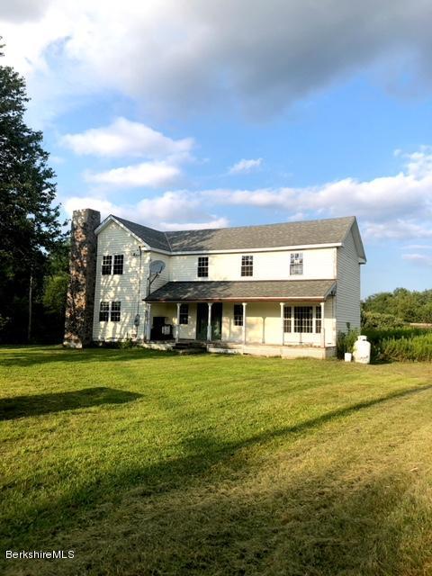 145 S Road Peru, MA 01235 - Photo 1 of 30 a front view of a house with a garden