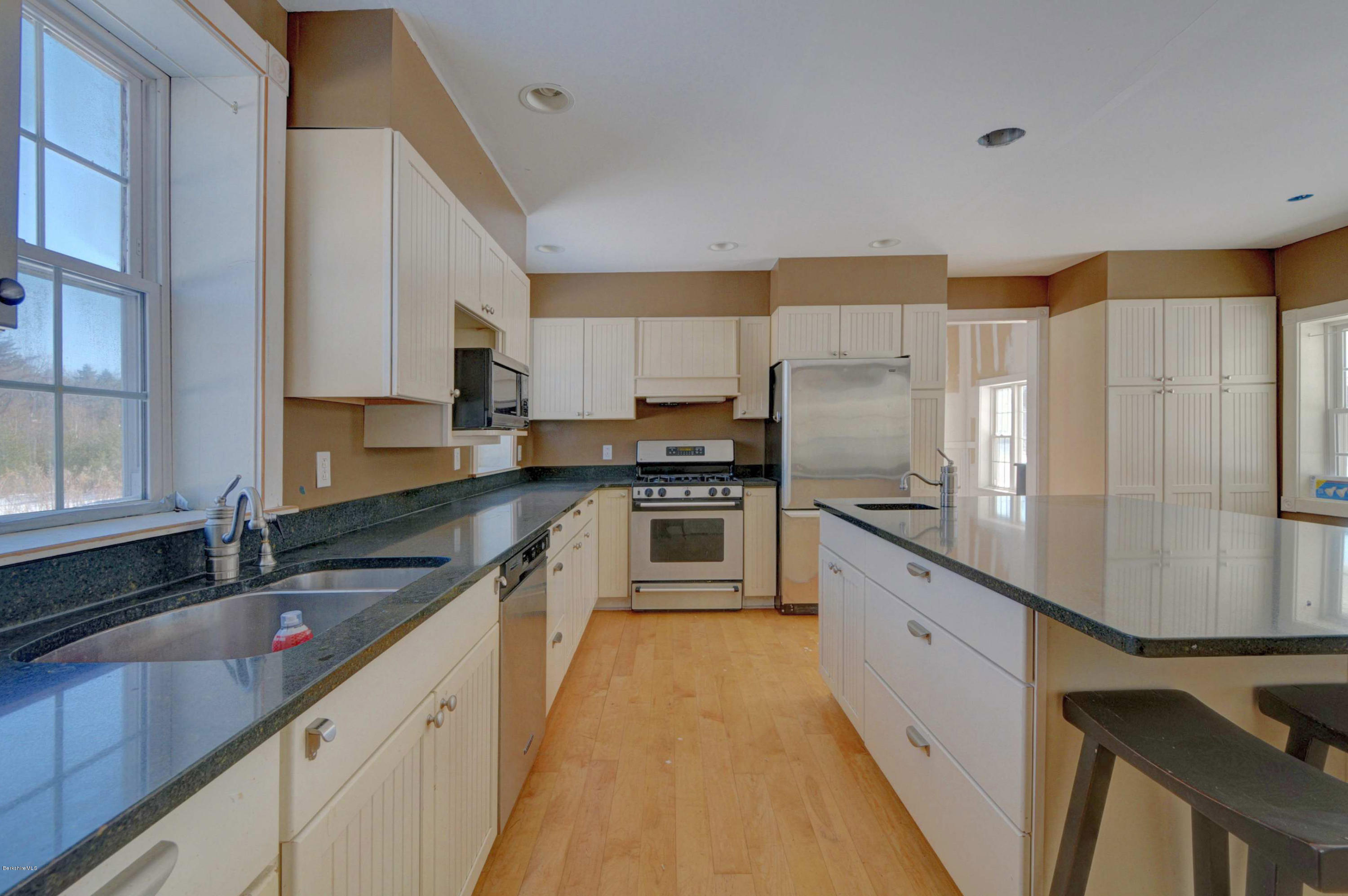 145 S Road Peru, MA 01235 - Photo 13 of 30 a kitchen with granite countertop a sink stove and refrigerator