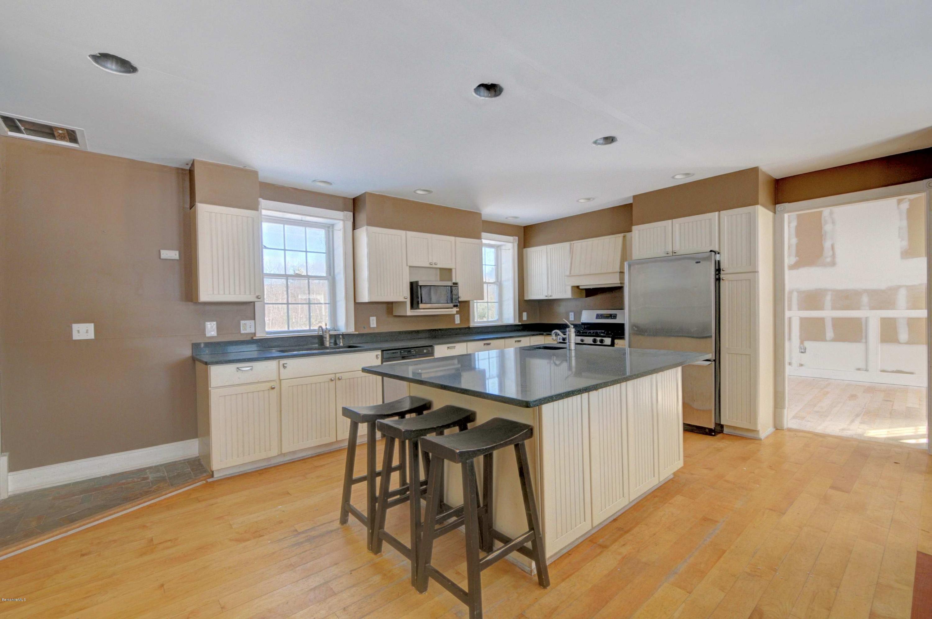 145 S Road Peru, MA 01235 - Photo 14 of 30 a kitchen with stainless steel appliances granite countertop a sink stove and refrigerator