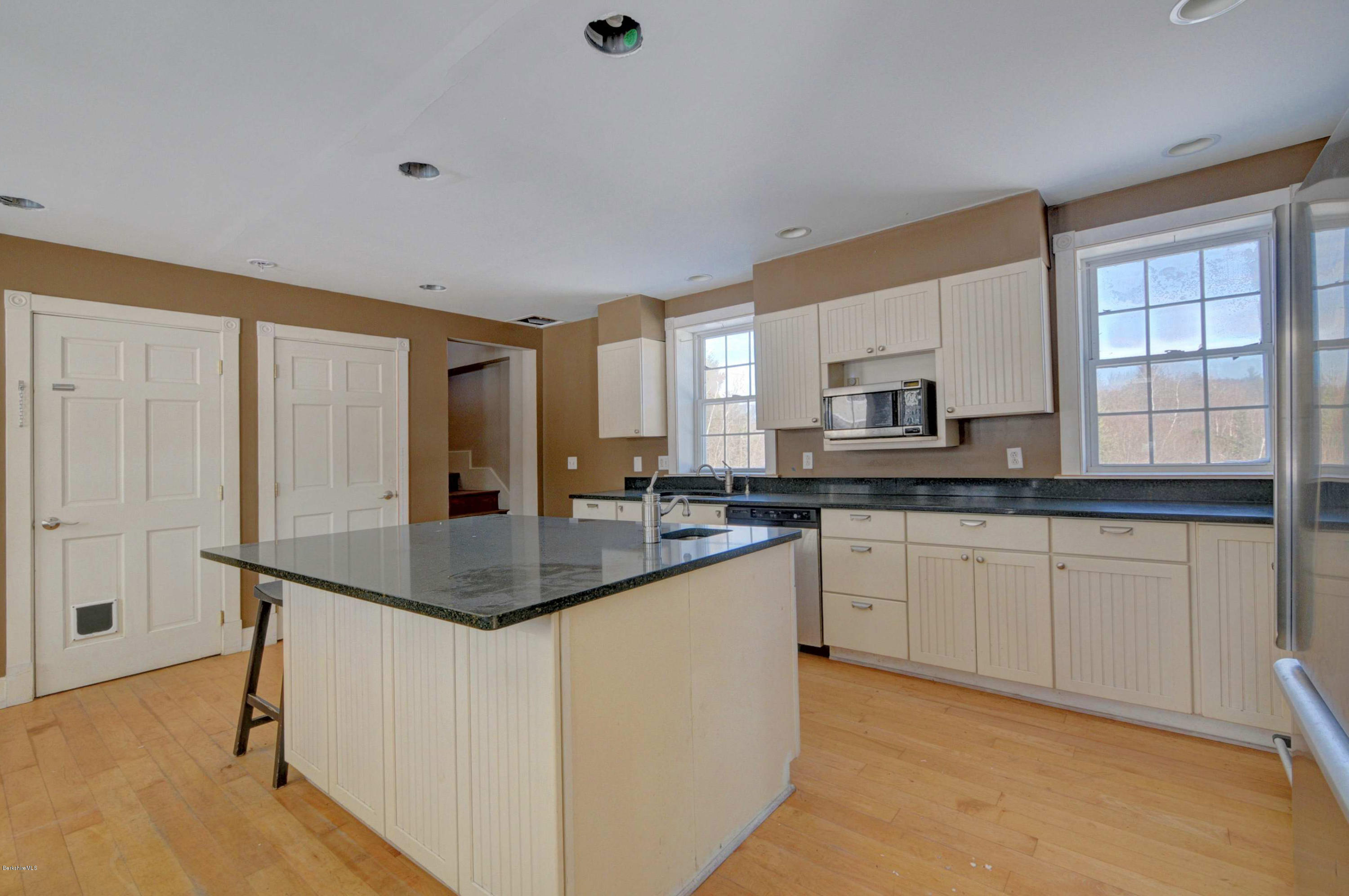145 S Road Peru, MA 01235 - Photo 15 of 30 a kitchen with stainless steel appliances granite countertop a sink a stove and a refrigerator