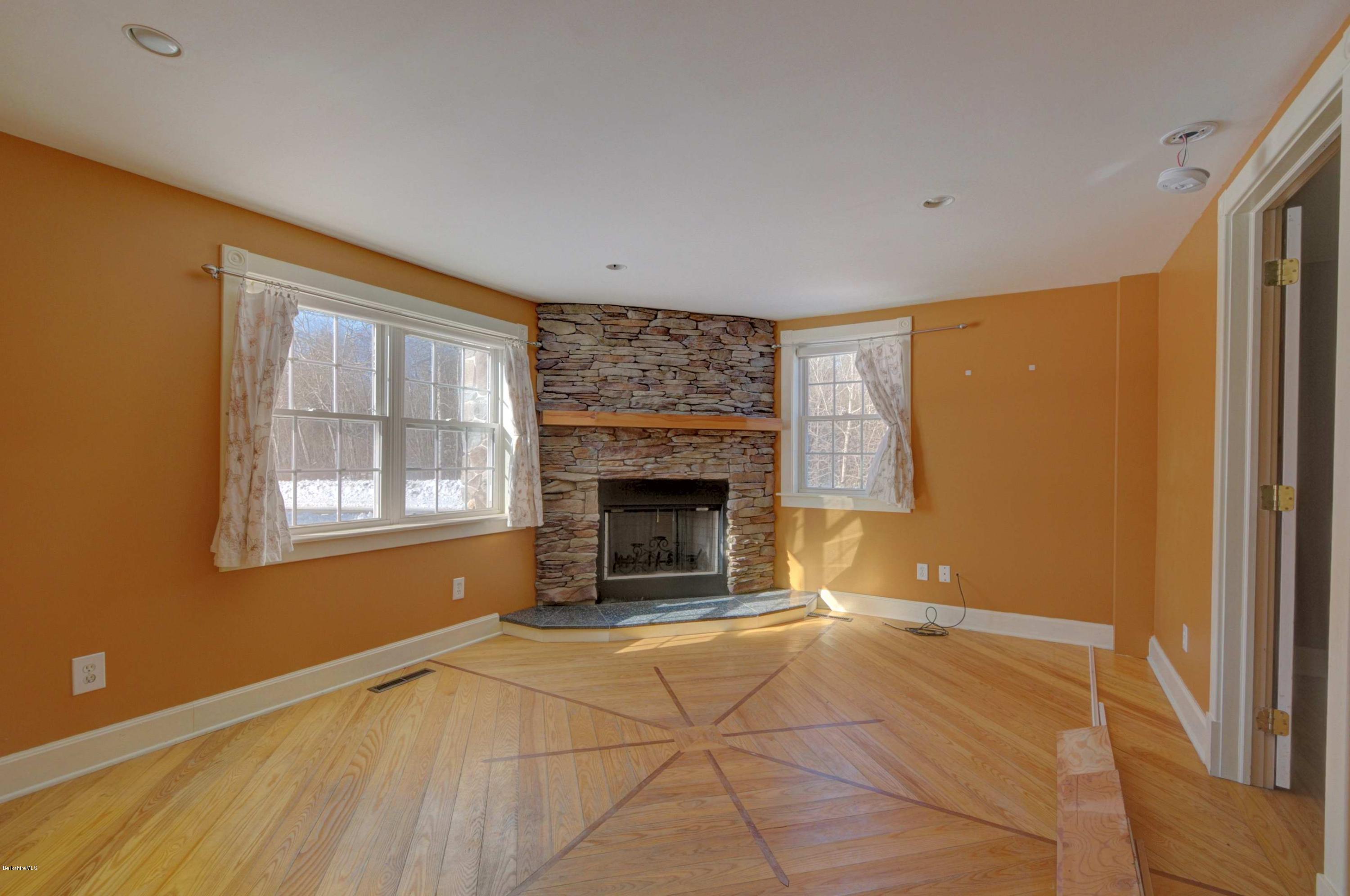 145 S Road Peru, MA 01235 - Photo 16 of 30 a view of an empty room with a fireplace and a window