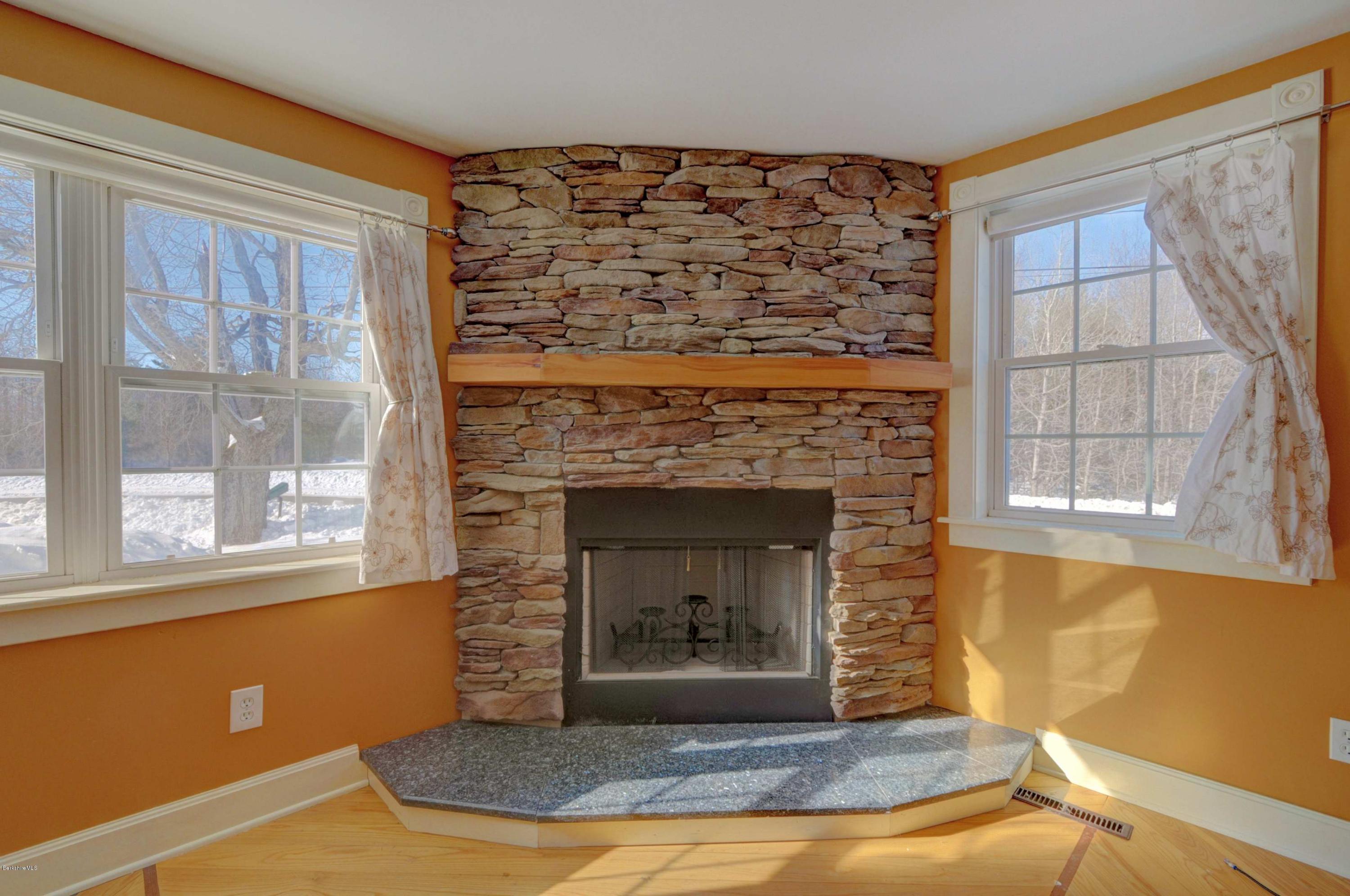 145 S Road Peru, MA 01235 - Photo 17 of 30 a view of a livingroom with a fireplace and window