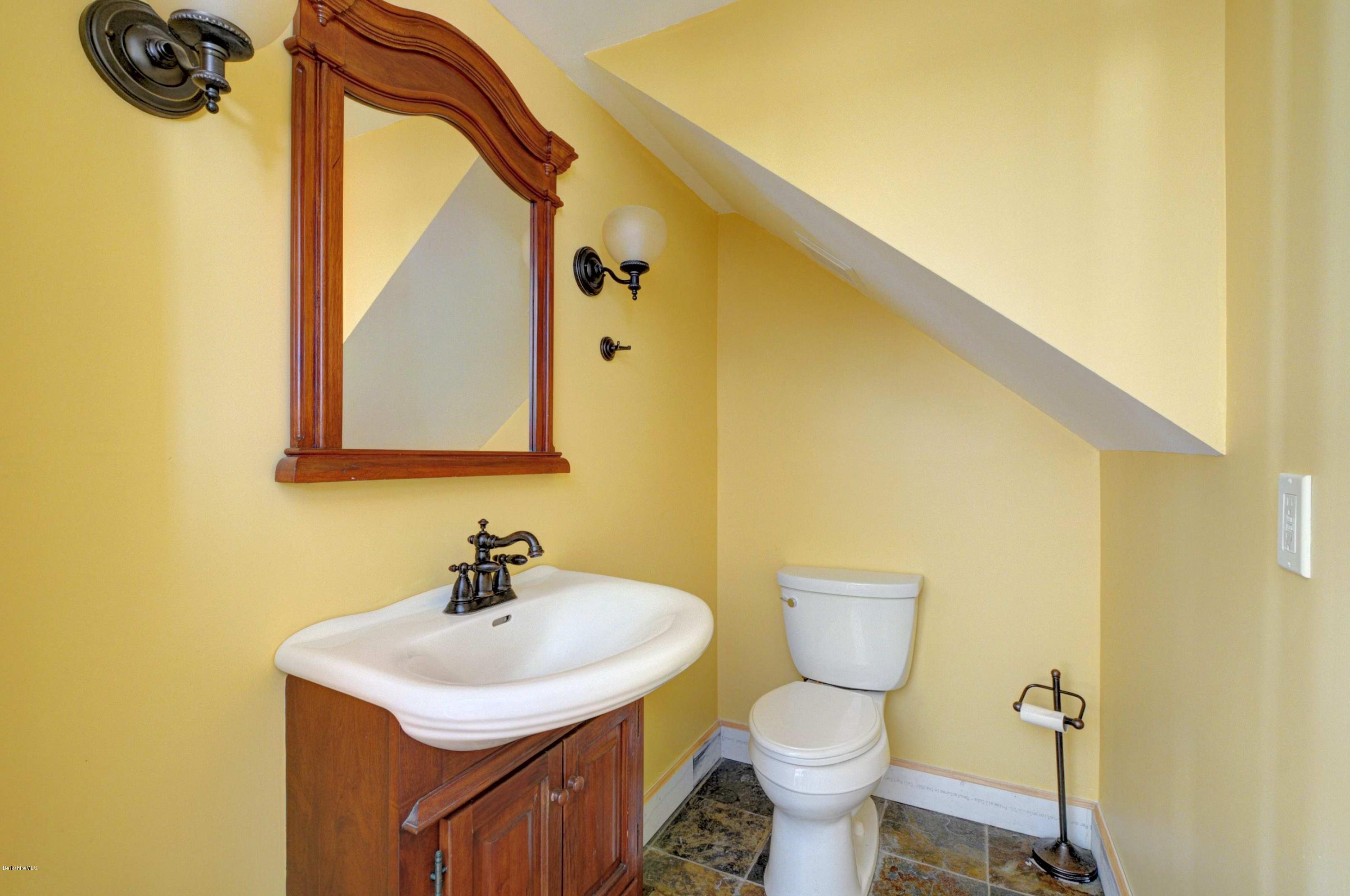 145 S Road Peru, MA 01235 - Photo 21 of 30 a bathroom with a toilet sink and mirror