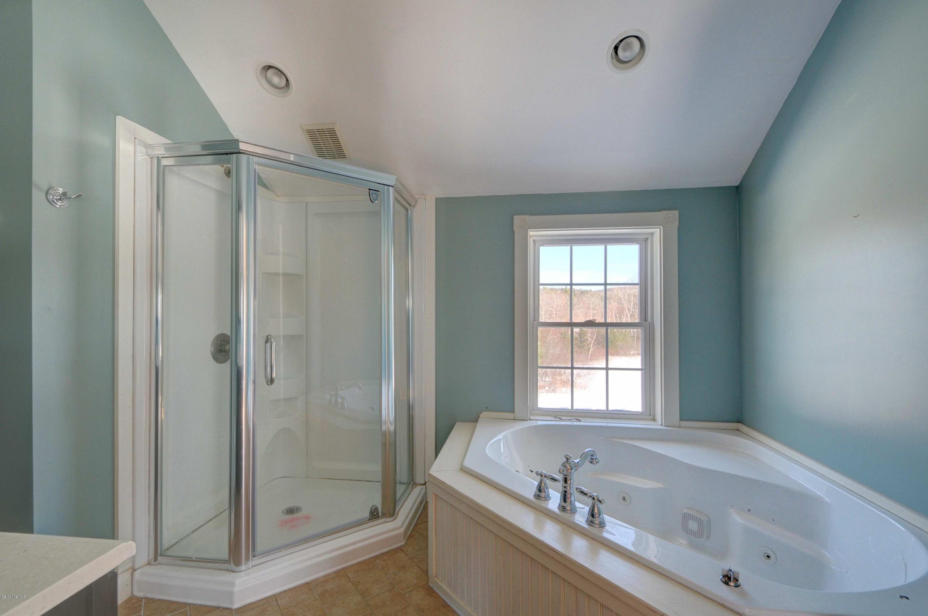 145 S Road Peru, MA 01235 - Photo 28 of 30 a bathroom with a bathtub and a shower