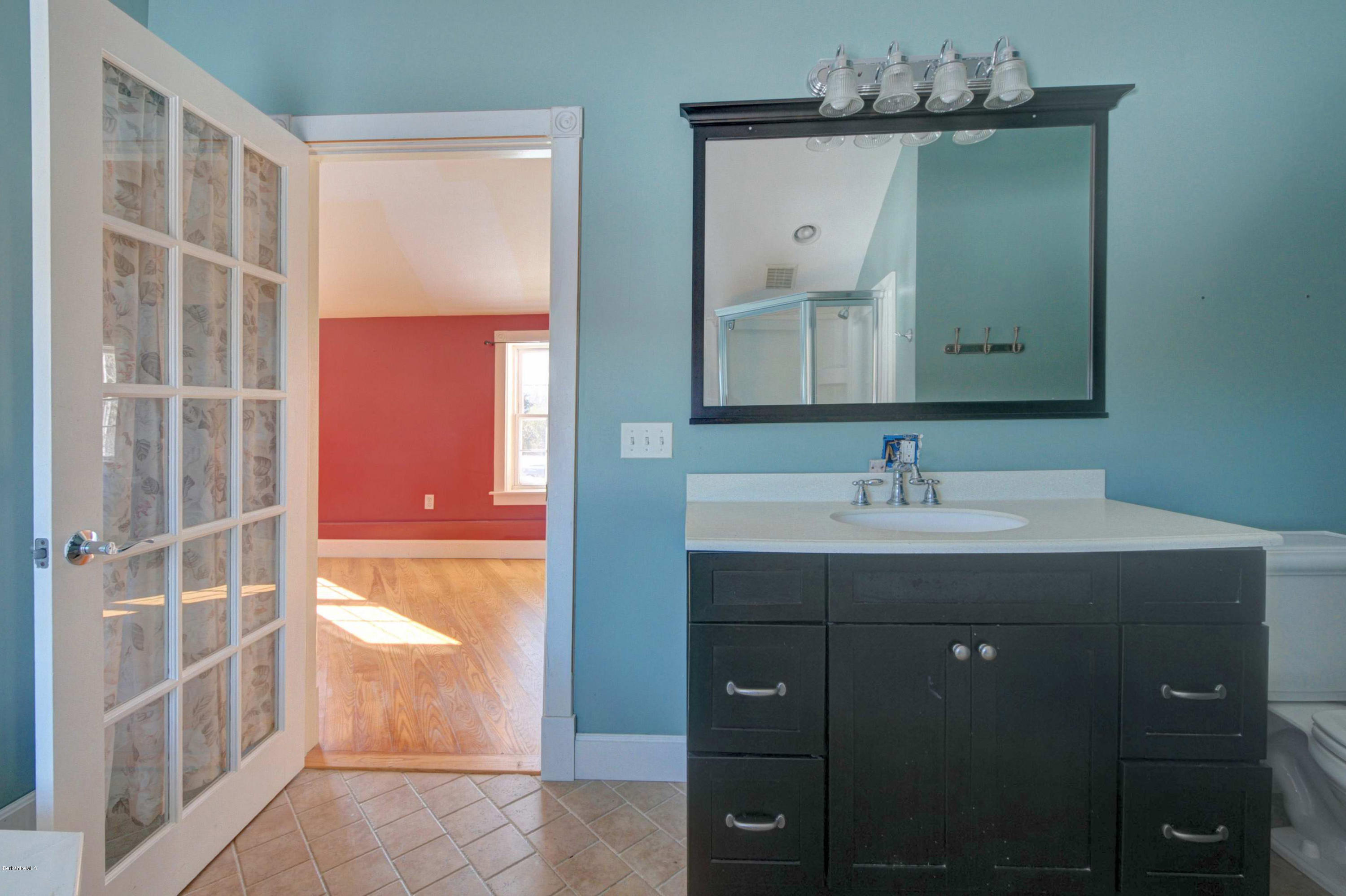 145 S Road Peru, MA 01235 - Photo 29 of 30 a bathroom with a sink vanity and mirror