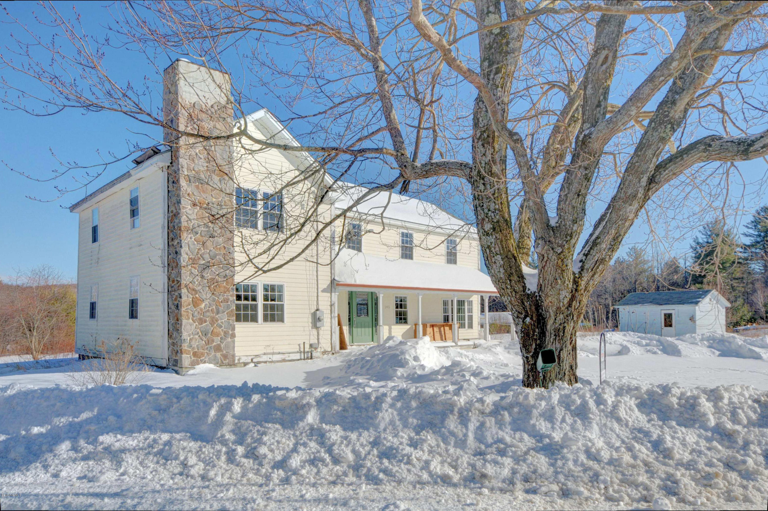 145 S Road Peru, MA 01235 - Photo 7 of 30 a view of a large white house with a large tree