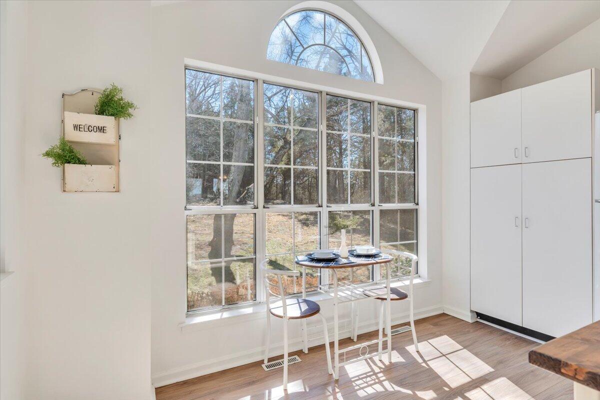 432 Arch Mill Road Buchanan, VA 24066 - Photo 25 of 72 a dining room with wooden floor and a table