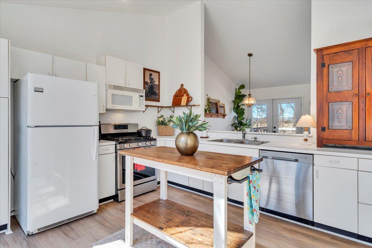 432 Arch Mill Road Buchanan, VA 24066 - Photo 30 of 72 a kitchen with a refrigerator and a sink
