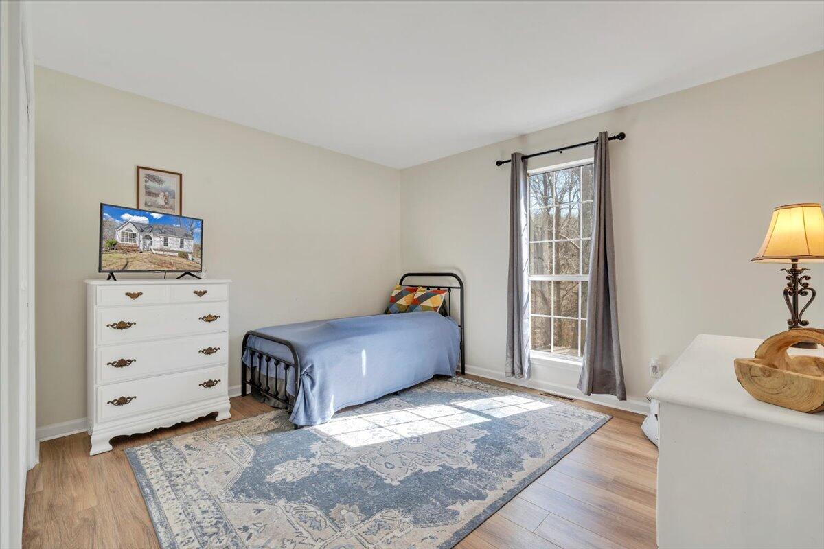 432 Arch Mill Road Buchanan, VA 24066 - Photo 40 of 72 a bedroom with a bed and a cabinets