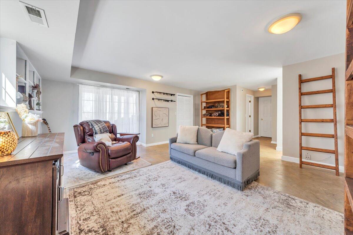 432 Arch Mill Road Buchanan, VA 24066 - Photo 47 of 72 a living room with furniture and a flat screen tv