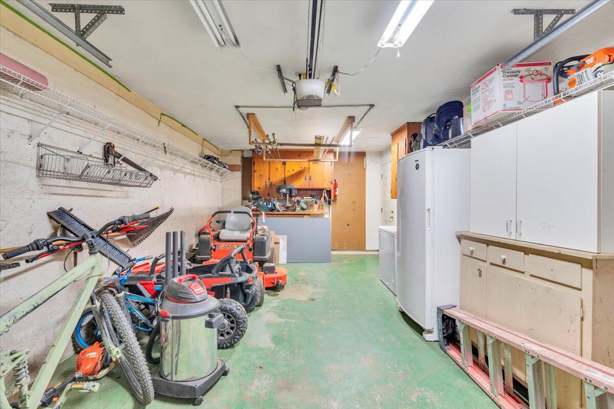 432 Arch Mill Road Buchanan, VA 24066 - Photo 54 of 72 a storage room with water heater and refrigerator