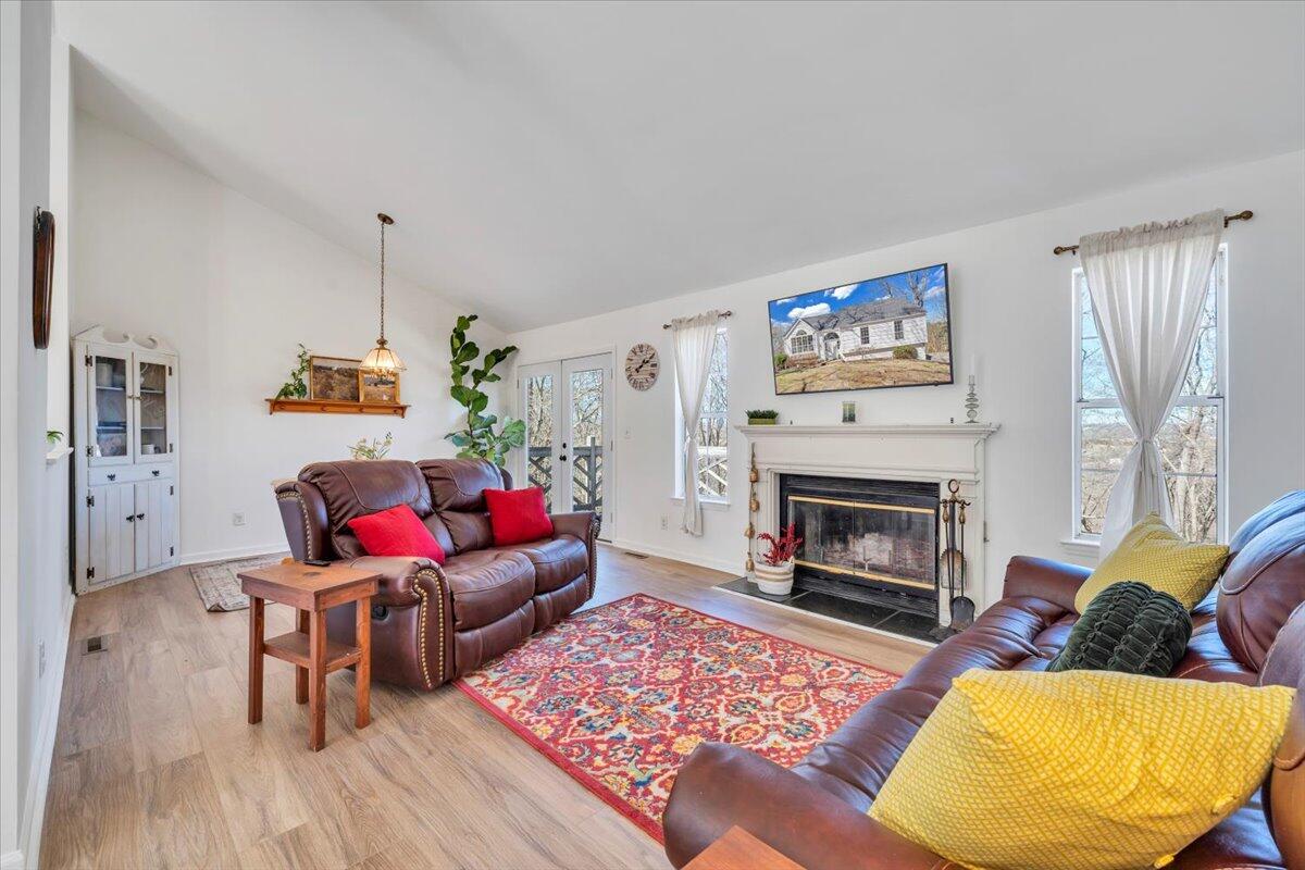 432 Arch Mill Road Buchanan, VA 24066 - Photo 9 of 72 a living room with furniture and a fireplace