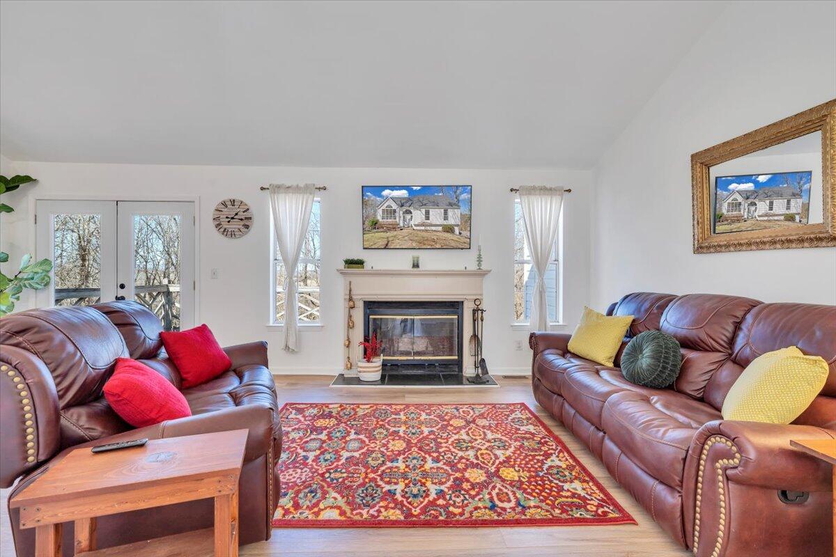 432 Arch Mill Road Buchanan, VA 24066 - Photo 10 of 72 a living room with furniture a fireplace and a fireplace
