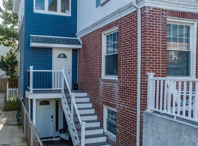 a front view of a house with a fence