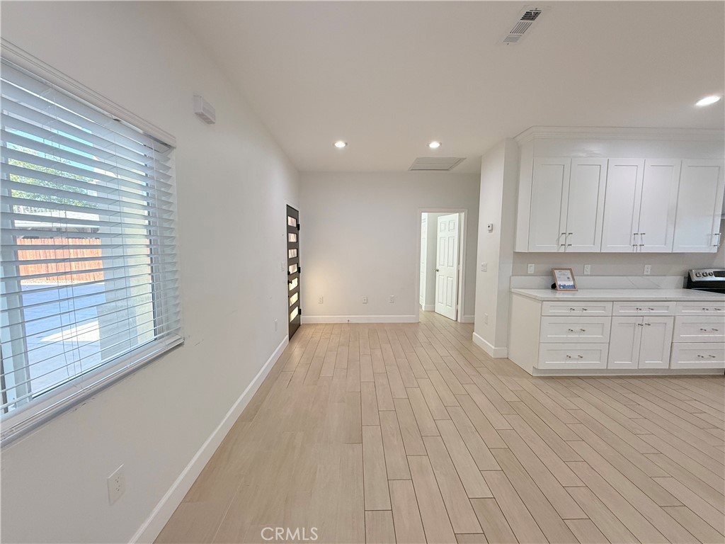 125 North Orangewood Street Colton, CA 92324 - Photo 6 of 12 a view of a kitchen with wooden floor