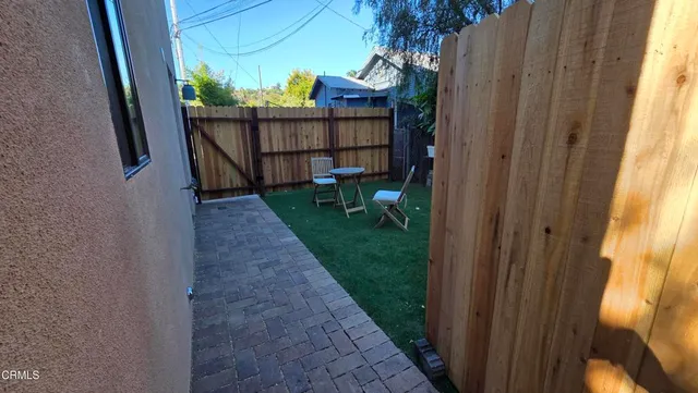 a view of a backyard with a garden and plants