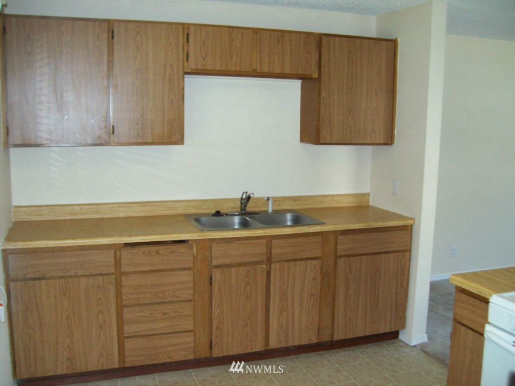 614 Index Avenue Northeast Renton, WA 98056 - Photo 11 of 14 a room with a sink cabinets and utility