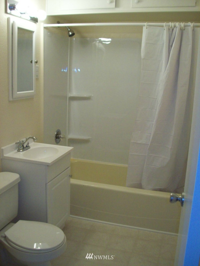 614 Index Avenue Northeast Renton, WA 98056 - Photo 5 of 14 a bathroom with a sink a toilet and shower