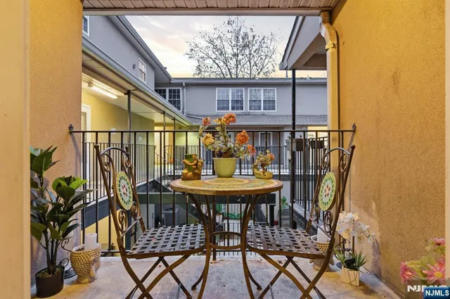 a view of balcony with furniture and wooden deck