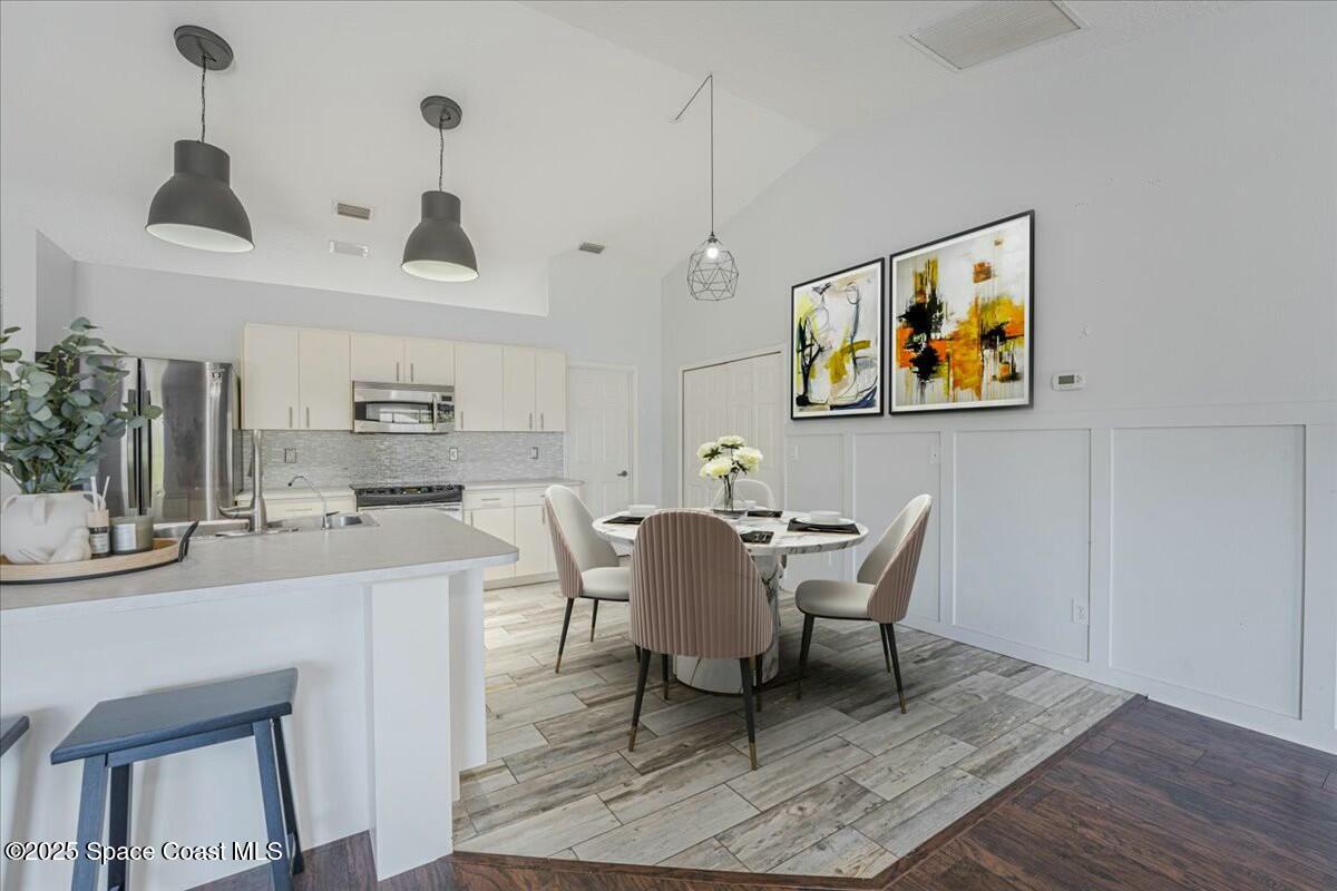 194 Saybrook Road Southwest Palm Bay, FL 32908 - Photo 16 of 35 a dining room with furniture and window