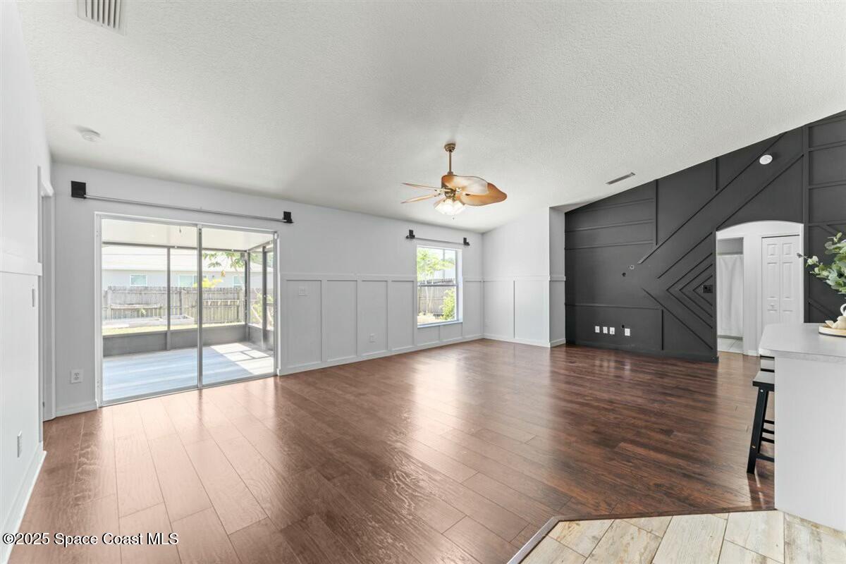194 Saybrook Road Southwest Palm Bay, FL 32908 - Photo 19 of 35 a view of empty room with wooden floor and fan