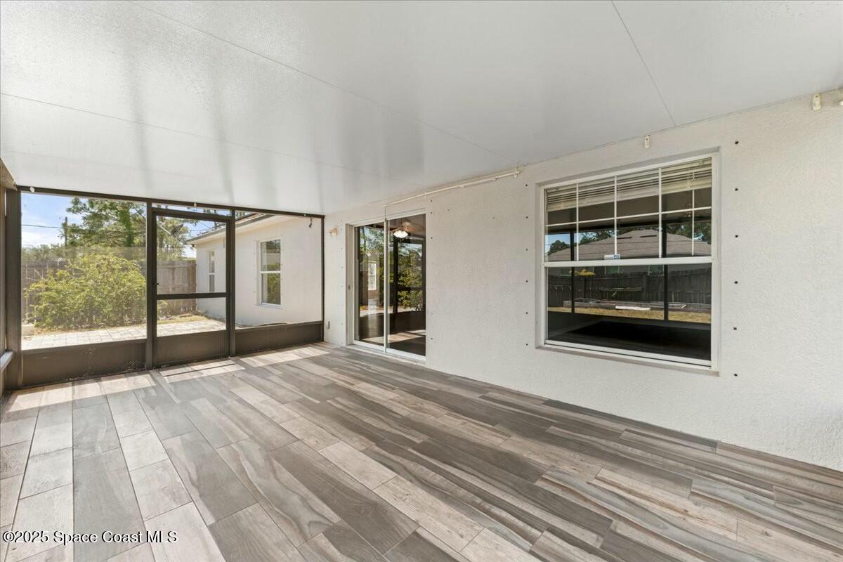 194 Saybrook Road Southwest Palm Bay, FL 32908 - Photo 21 of 35 a view of an empty room with a window