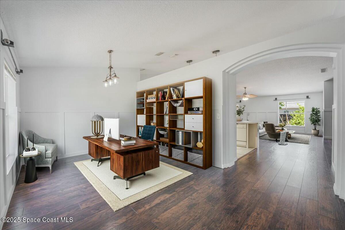 194 Saybrook Road Southwest Palm Bay, FL 32908 - Photo 3 of 35 a living room with furniture and wooden floor