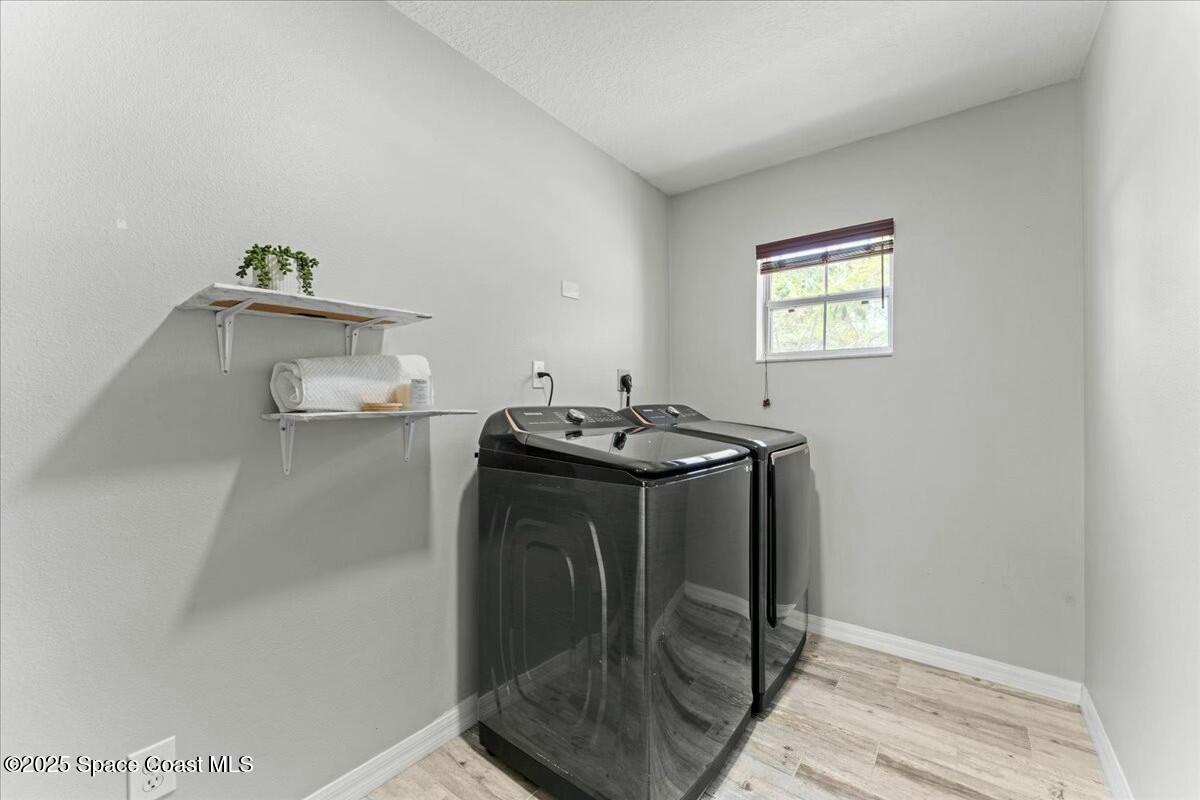 194 Saybrook Road Southwest Palm Bay, FL 32908 - Photo 35 of 35 a bathroom with a sink and a mirror