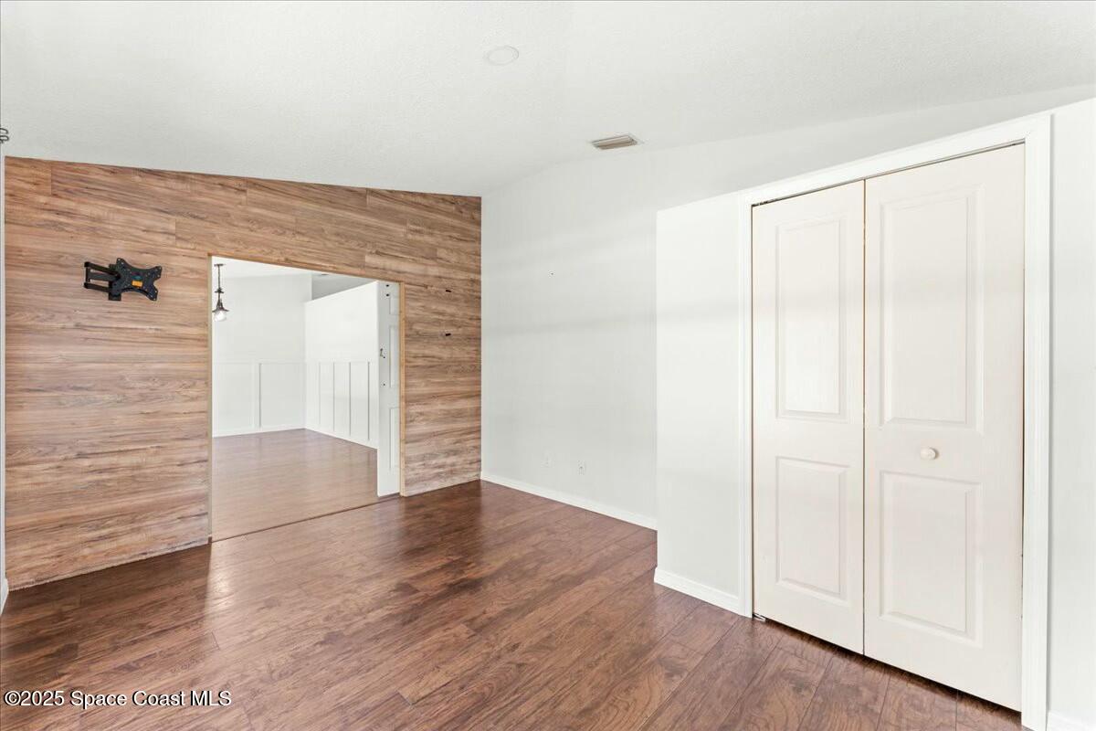 194 Saybrook Road Southwest Palm Bay, FL 32908 - Photo 8 of 35 wooden floor in an empty room
