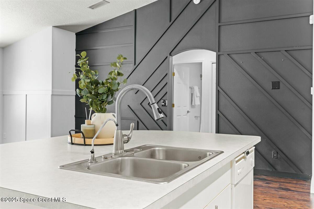 194 Saybrook Road Southwest Palm Bay, FL 32908 - Photo 9 of 35 a close view of a sink a faucet and appliance in the kitchen