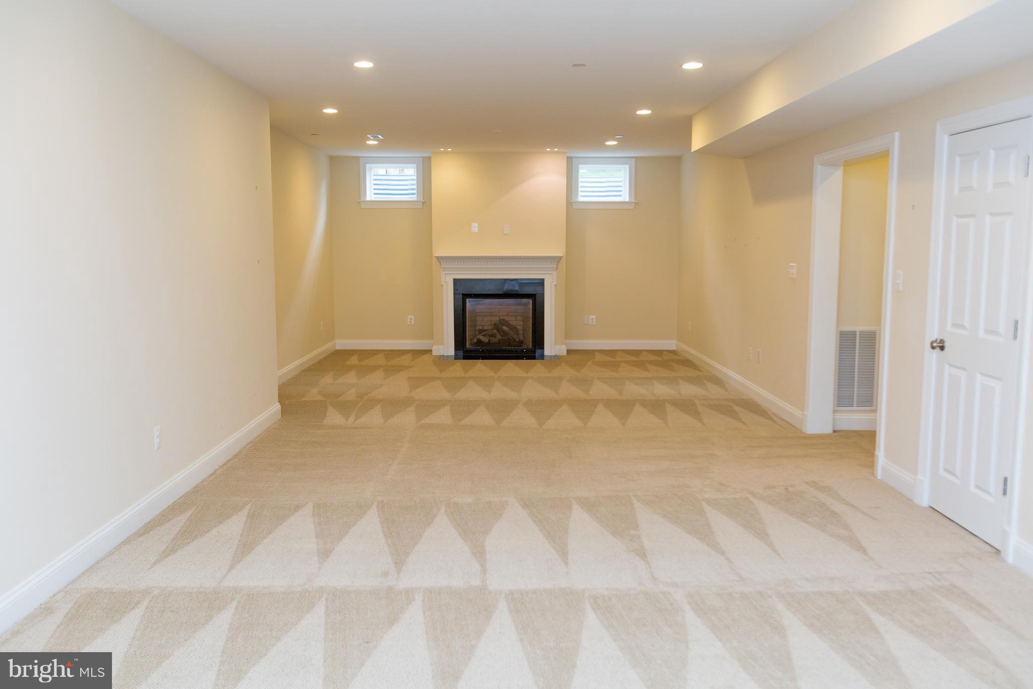 4314 Chestnut Street Bethesda, MD 20814 - Photo 13 of 28 Family Room downstairs with fireplace