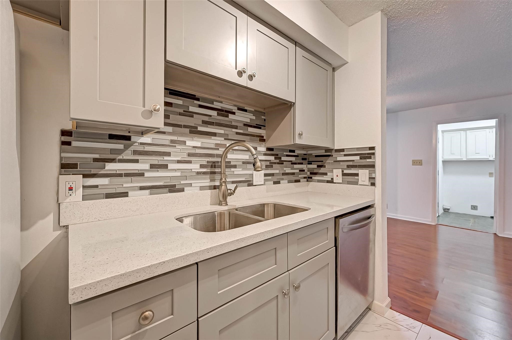 8101 Amelia Road, Unit 206 Houston, TX 77055 - Photo 15 of 32 a kitchen with a sink and cabinets