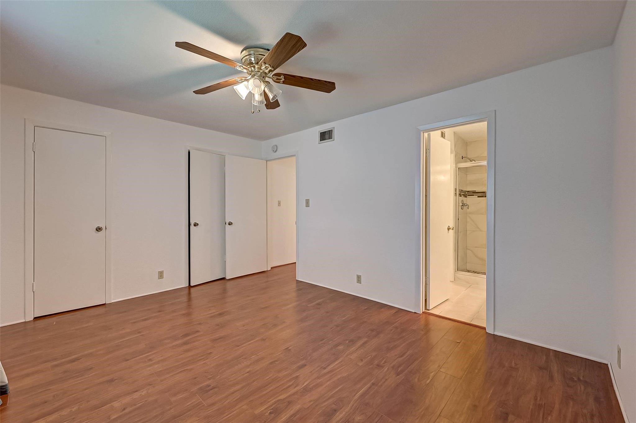 8101 Amelia Road, Unit 206 Houston, TX 77055 - Photo 25 of 32 a view of an empty room with wooden floor