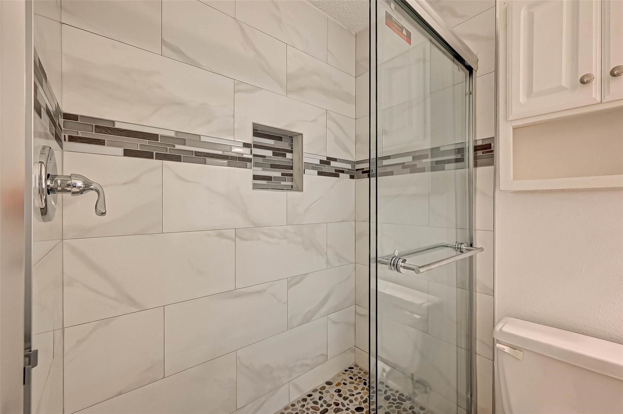 8101 Amelia Road, Unit 206 Houston, TX 77055 - Photo 29 of 32 a bathroom with a shower