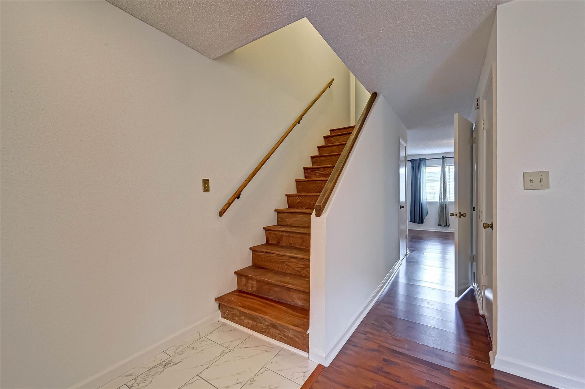 8101 Amelia Road, Unit 206 Houston, TX 77055 - Photo 6 of 32 a view of a hallway with wooden floor and entryway