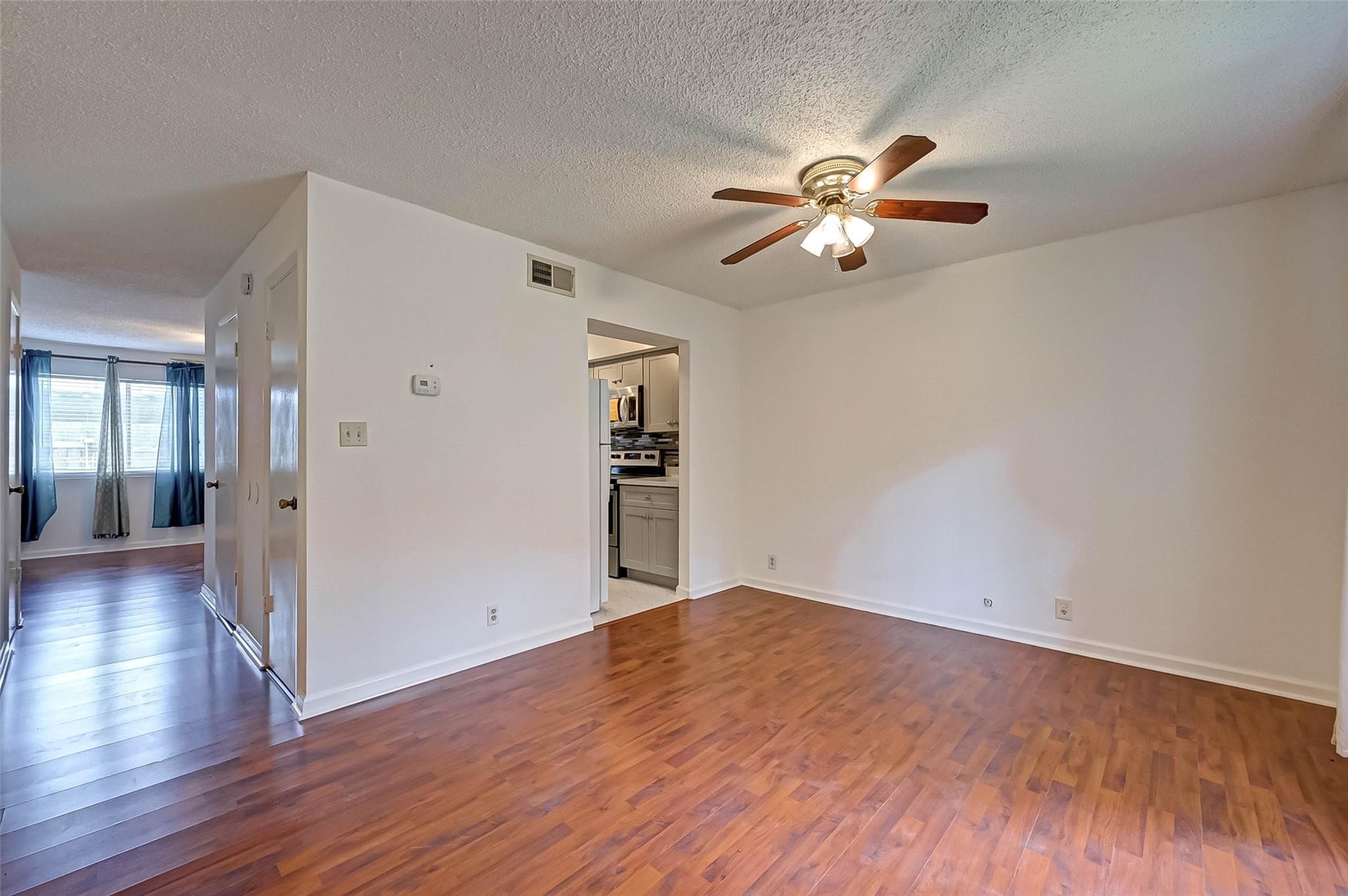 8101 Amelia Road, Unit 206 Houston, TX 77055 - Photo 7 of 32 a view of empty room with wooden floor