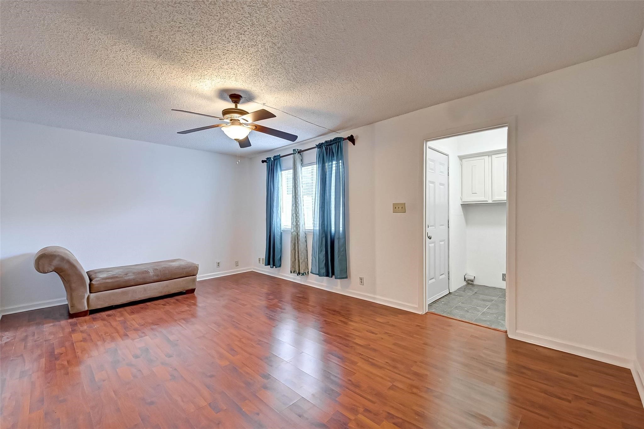 8101 Amelia Road, Unit 206 Houston, TX 77055 - Photo 10 of 32 wooden floor in an empty room with a window