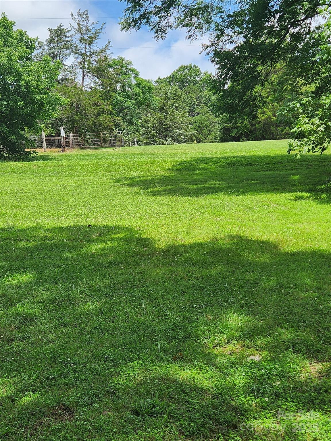 423 Tot Dellinger Road Cherryville, NC 28021 - Photo 11 of 14 a view of a grassy field with trees