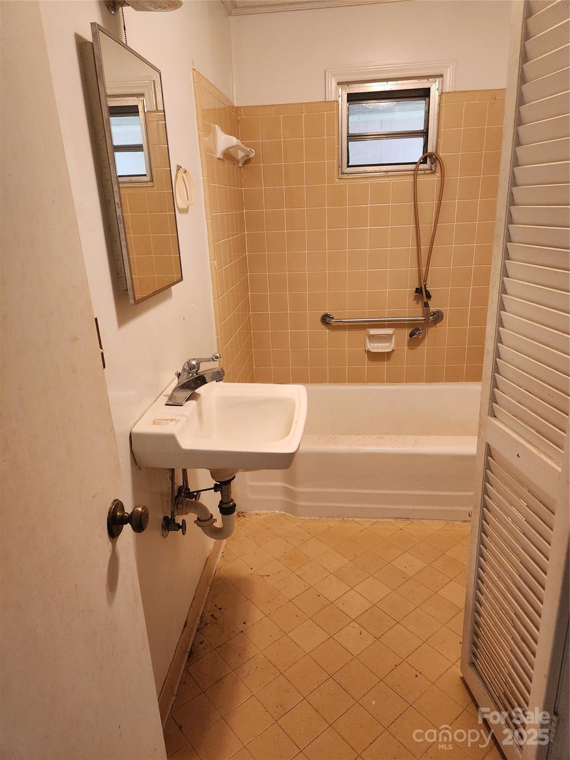 423 Tot Dellinger Road Cherryville, NC 28021 - Photo 5 of 14 a bathroom with a sink a bath tub and a shower