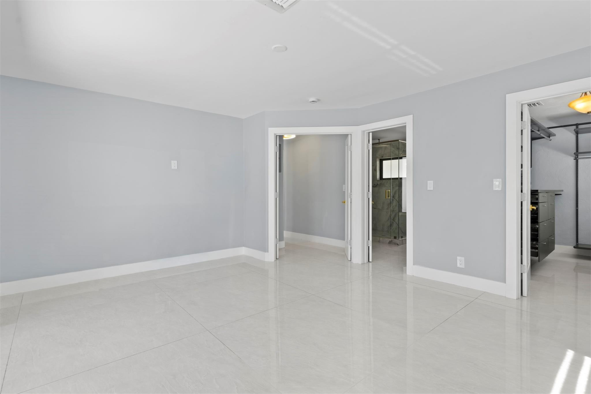 2310 Northeast 48th Court Lighthouse Point, FL 33064 - Photo 14 of 61 wooden floor in an empty room