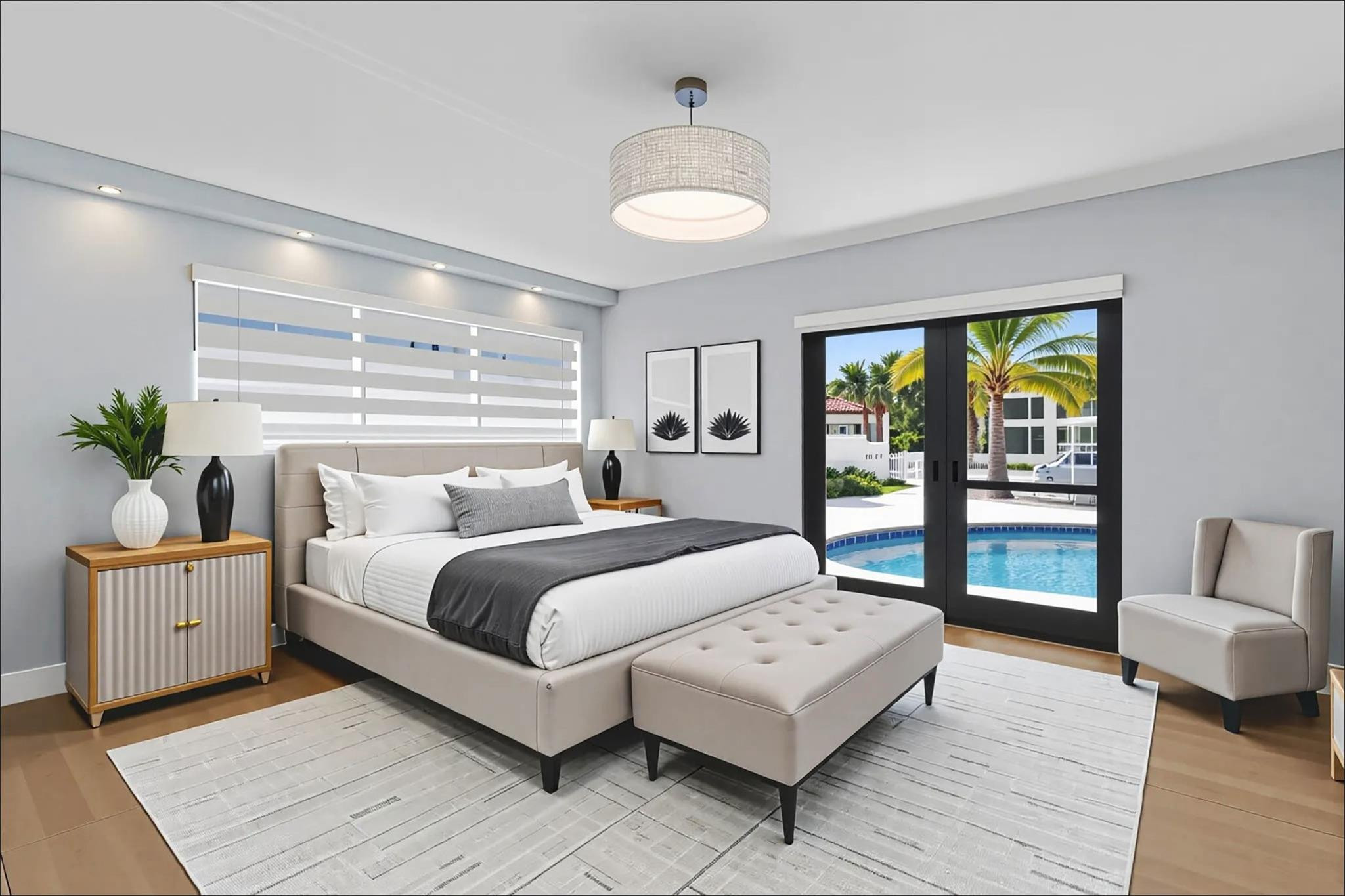 2310 Northeast 48th Court Lighthouse Point, FL 33064 - Photo 16 of 61 a bedroom with a large bed and a chandelier