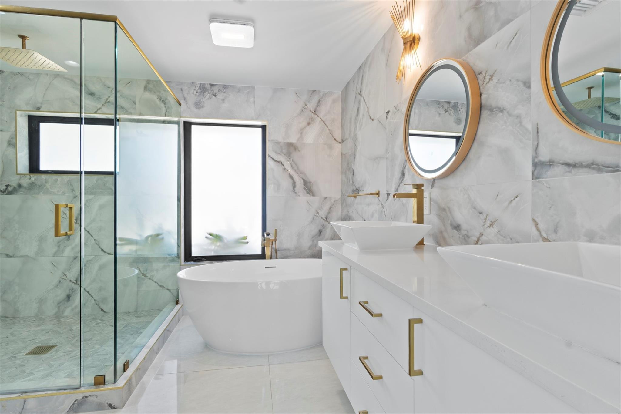 2310 Northeast 48th Court Lighthouse Point, FL 33064 - Photo 18 of 61 a bathroom with a bathtub and a sink