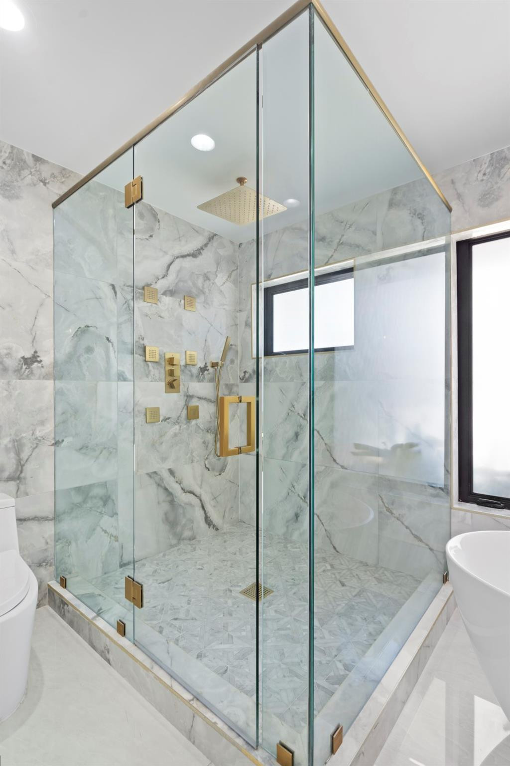 2310 Northeast 48th Court Lighthouse Point, FL 33064 - Photo 19 of 61 a bathroom with a shower and mirror