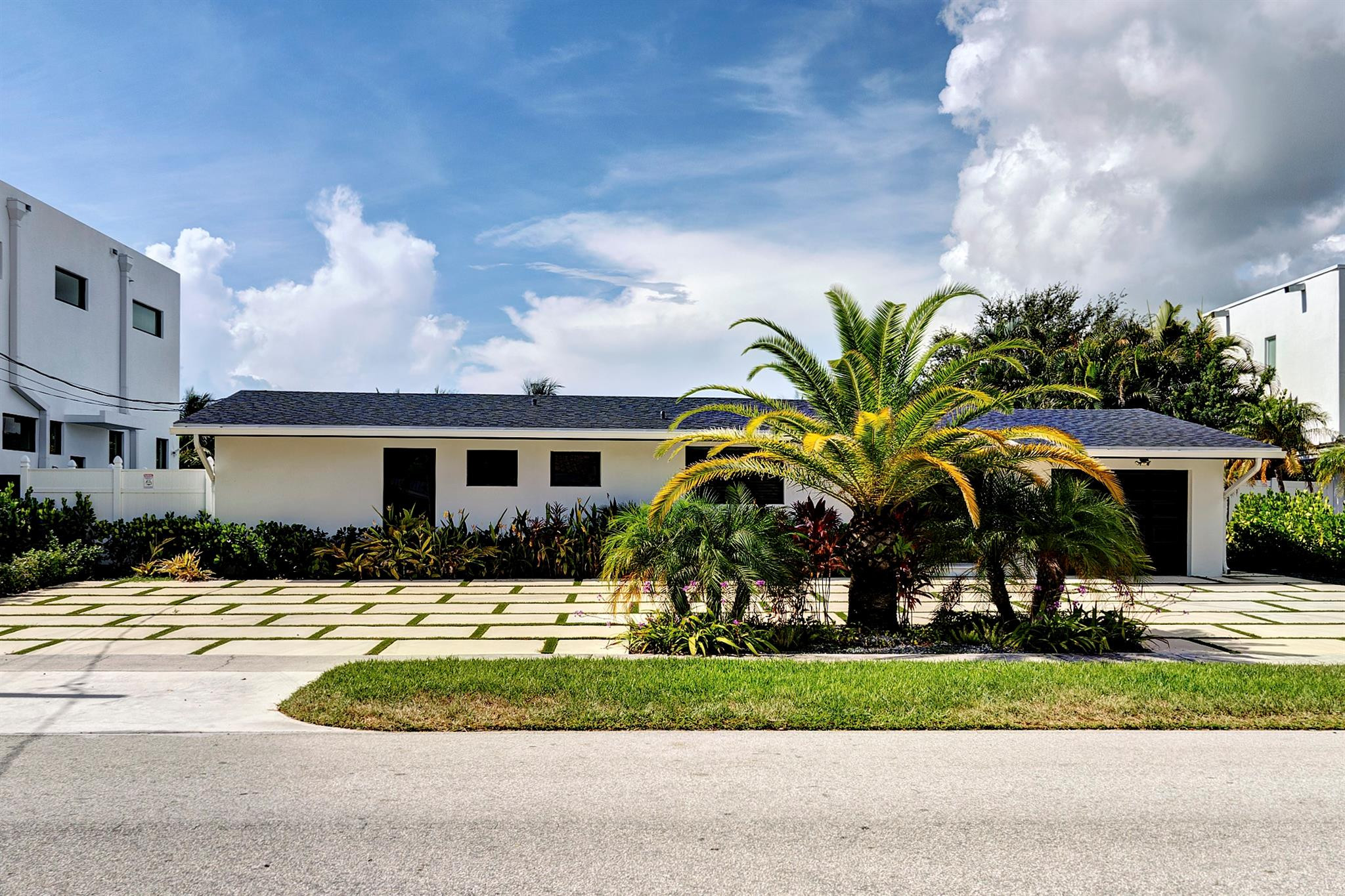 2310 Northeast 48th Court Lighthouse Point, FL 33064 - Photo 2 of 61 a house view with a outdoor space