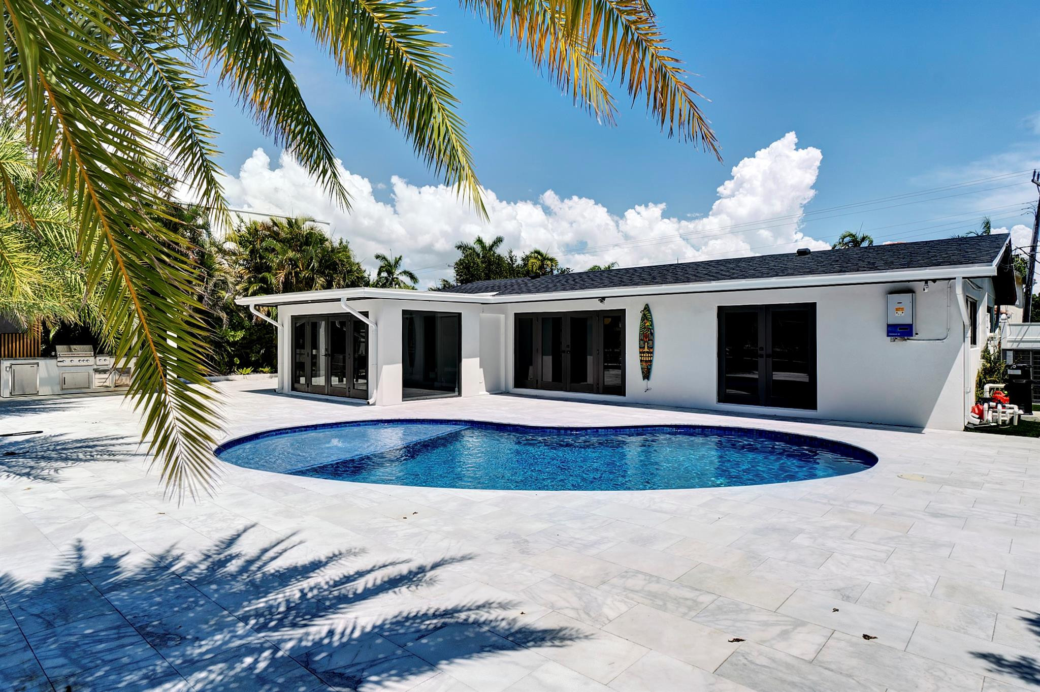 2310 Northeast 48th Court Lighthouse Point, FL 33064 - Photo 30 of 61 a view of a house with swimming pool and a yard