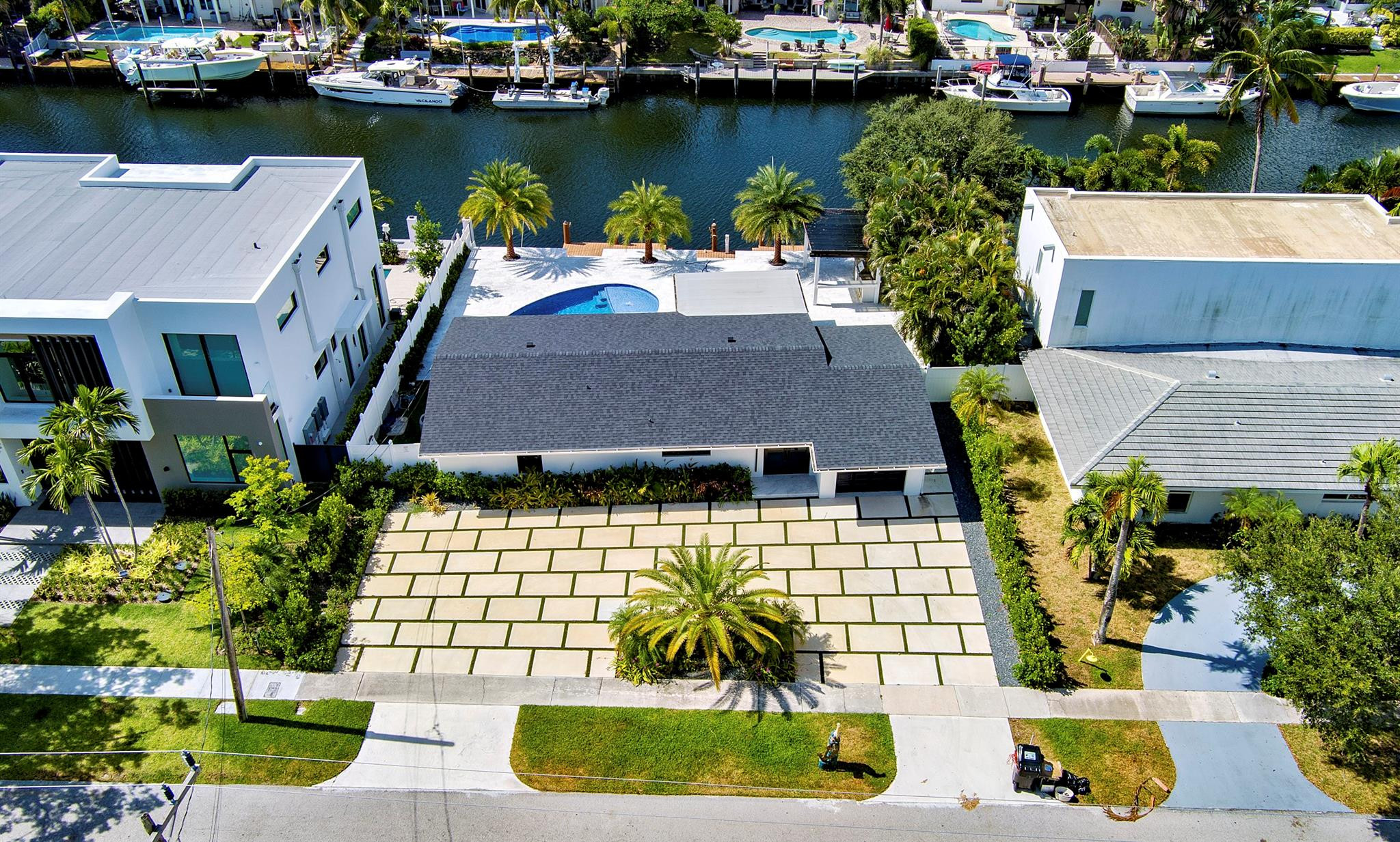 2310 Northeast 48th Court Lighthouse Point, FL 33064 - Photo 38 of 61 an aerial view of a house with a garden and lake view