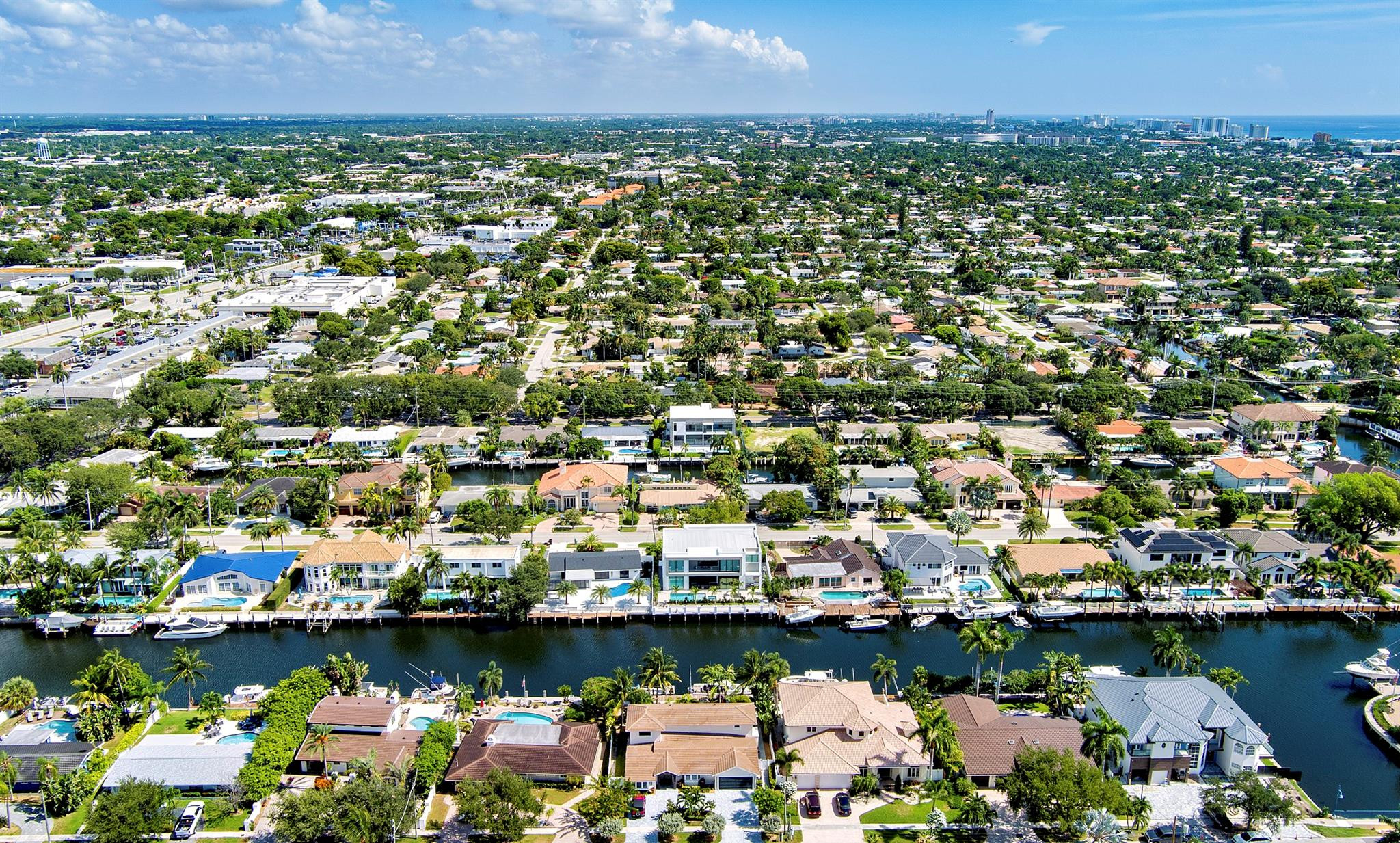 2310 Northeast 48th Court Lighthouse Point, FL 33064 - Photo 46 of 61 an aerial view of a city with lots of residential buildings lake and ocean view
