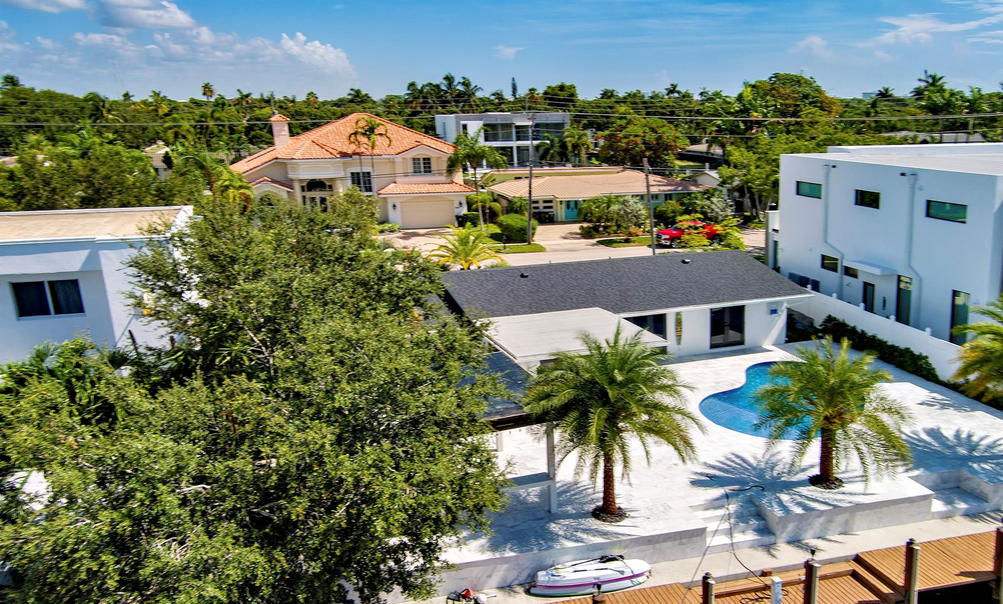 2310 Northeast 48th Court Lighthouse Point, FL 33064 - Photo 51 of 61 an aerial view of a house with a yard