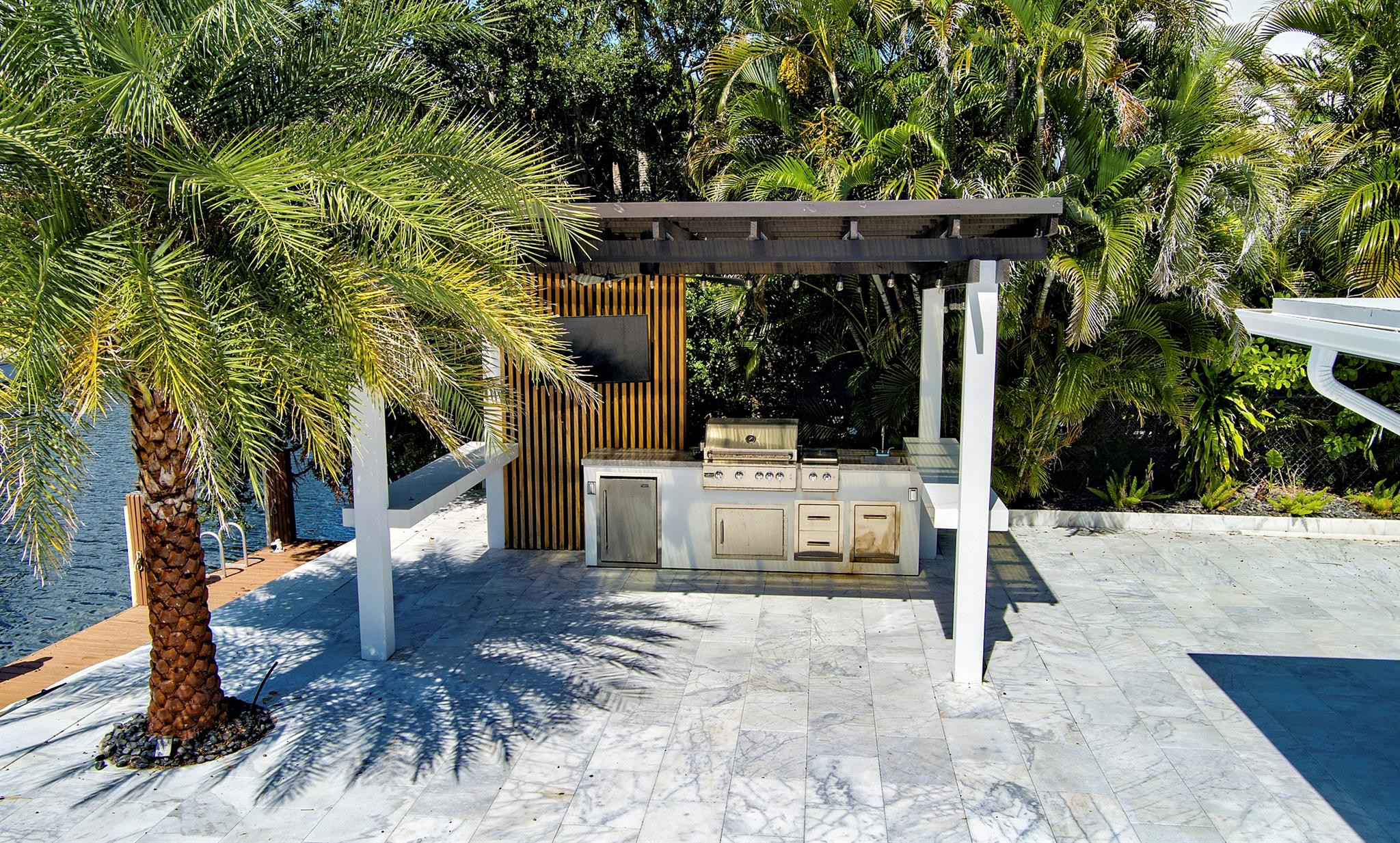 2310 Northeast 48th Court Lighthouse Point, FL 33064 - Photo 58 of 61 a view of a house with backyard and sitting area