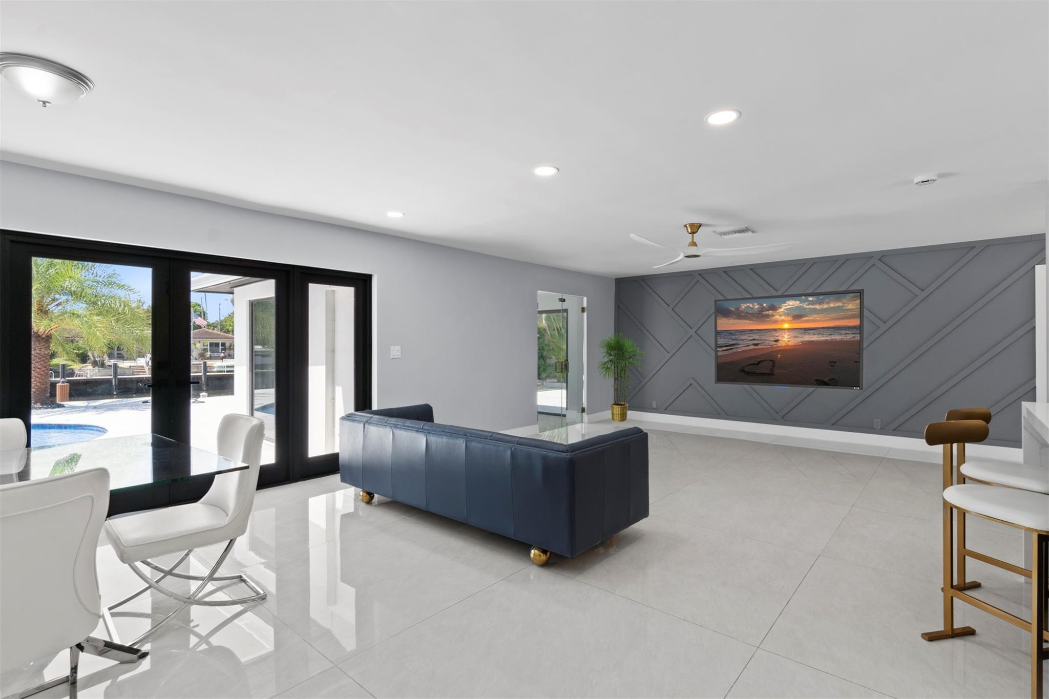 2310 Northeast 48th Court Lighthouse Point, FL 33064 - Photo 10 of 61 a living room with furniture and a flat screen tv